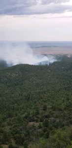 Smoke from the Dark Canyon Fire rises above the mountains