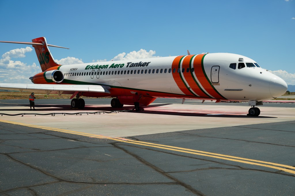 An MD-87 tanker is filled with retardant.
