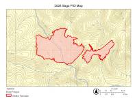 An irregular red shape stands out against a pale yellow background. A smaller red shape is not adjoining with the larger one.