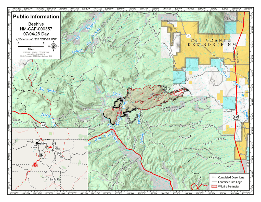 Map titled "Public Information – Beehive NM-CAF-000357, 07/04/26 Day," depicting the Beehive Fire in northern New Mexico. The wildfire perimeter is outlined in red, contained fire edge is shown in black, and completed dozer lines are marked with a crosshatched pattern. The fire is centered west of Rio Grande del Norte, with nearby features labeled, including Little Arsenic Creek, Rio Tusas, and several Forest Roads. Major highways 64 and 285 are shown, along with shaded public land boundaries. An inset map in the lower left shows the fire's location within New Mexico. The map notes the fire size as 4,554 acres at 11:35 a.m. MDT on July 3, 2026.